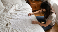 She Uses Doilies To Decorate A Headboard With Vintage Charm